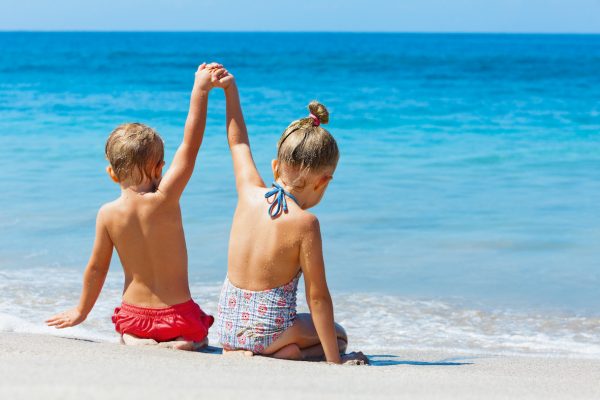 Kids on the beach | Featured image for the Divorce and Property Settlements page for Skene Lawyers.